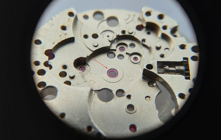 An oiler placing a drop of oil on the center-wheel jewel in the mainplate