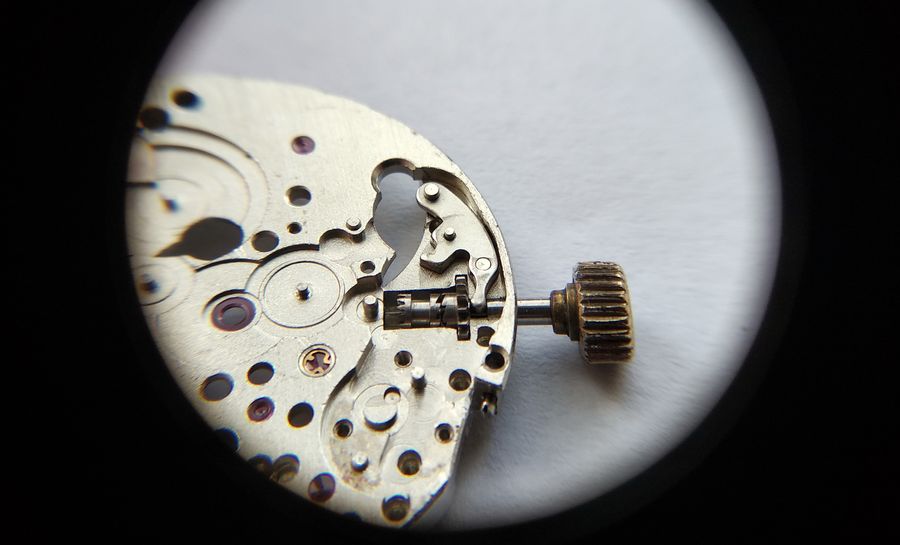 The intermediate setting lever being placed onto its post in the keyless works