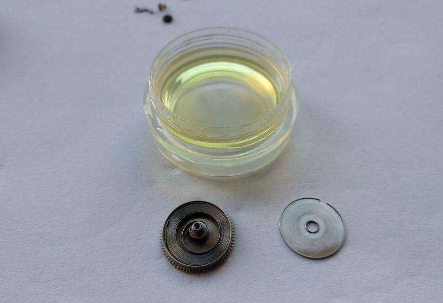 B-1 grease being applied to the coils of the mainspring