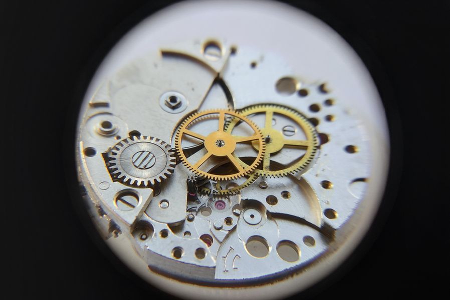 The intermediate, seconds and escape wheels all seated together on the plate