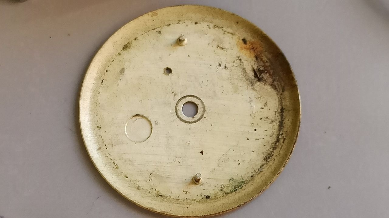 Contamination under dial