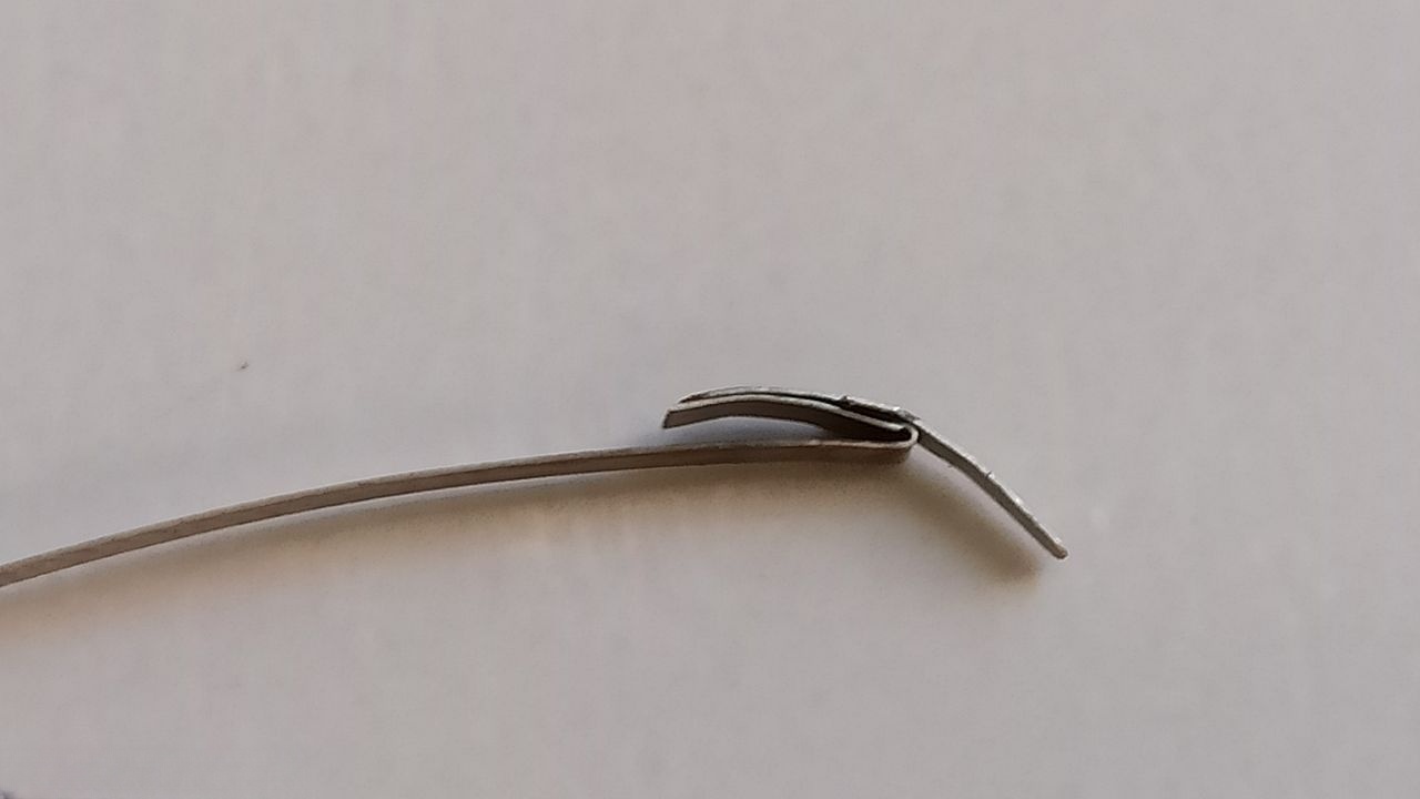 Mainspring showing previous repair