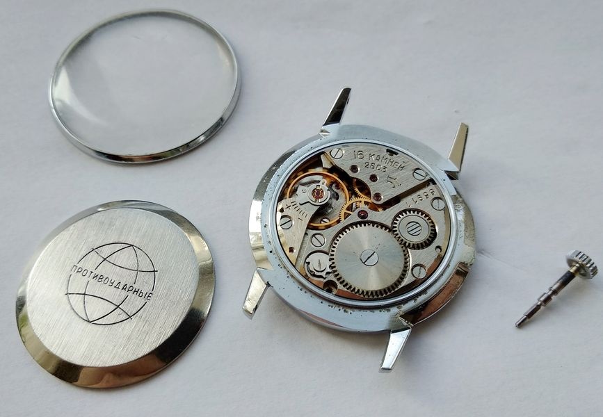 Movement dust cover showing shock-protected marking