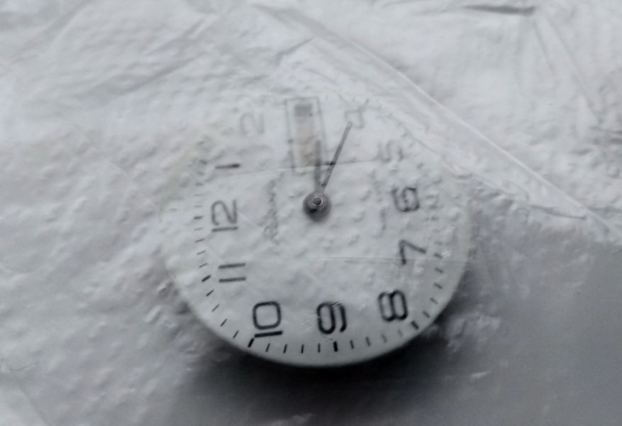Protective film over dial for hand removal