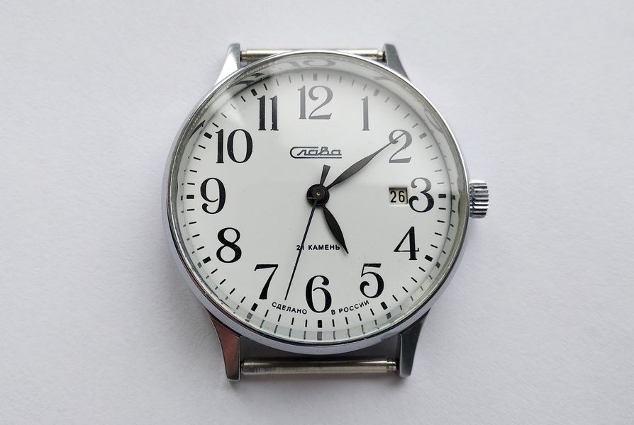 Front view of Slava 2414 showing white dial and shaped hands