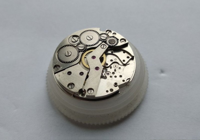 Caliber positioned for gear train disassembly