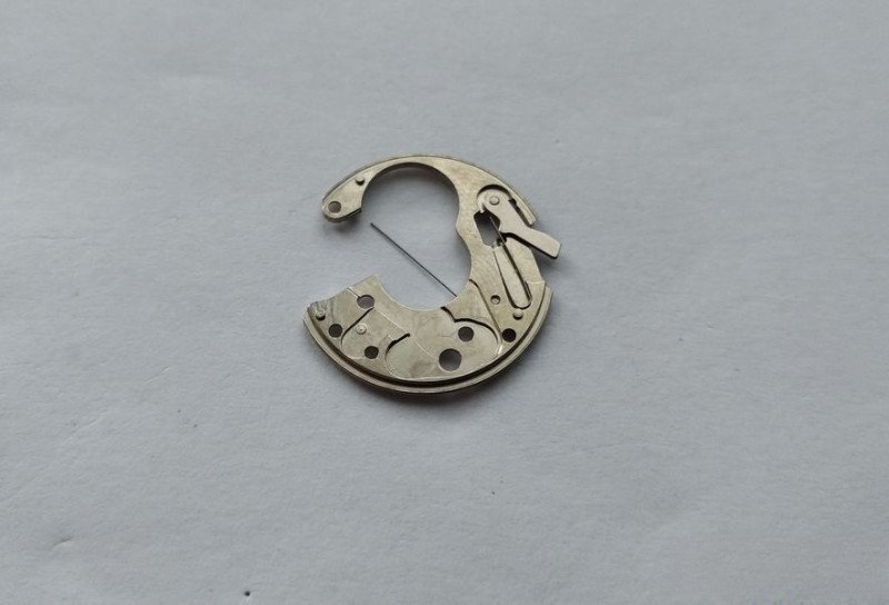 Positioning lever plate assembly with spring and lever