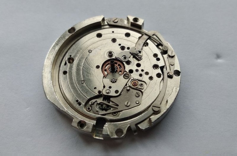 Removing double-tier wheel, date lever, and accumulator spring