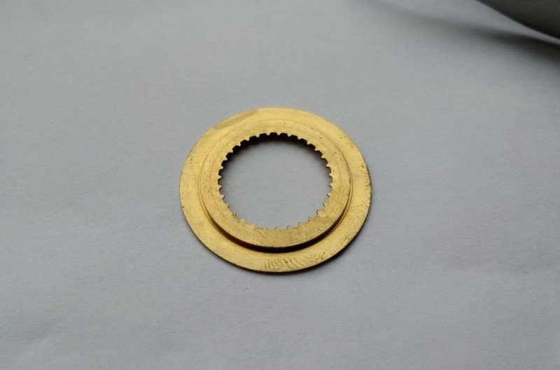 Reverse side of date disc showing gear teeth