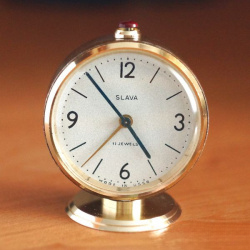 Slava alarm clock front view showing worn condition before restoration
