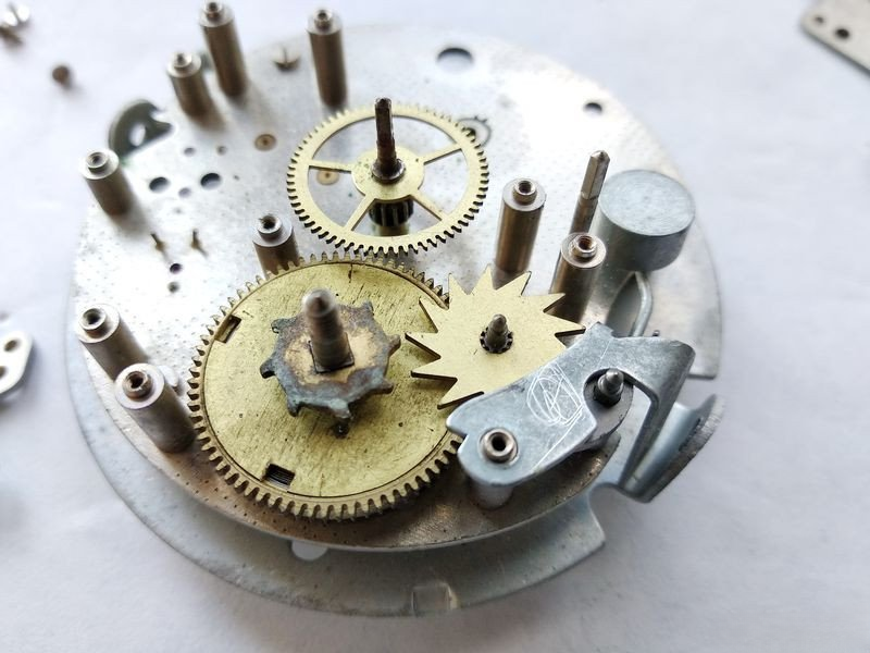 Alarm mechanism exposed showing barrel and hammer wheel
