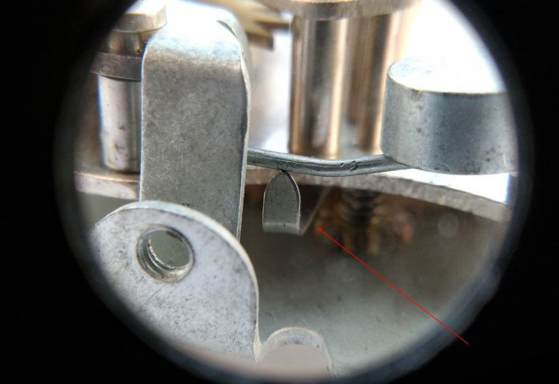 Checking alarm release spring adjustment