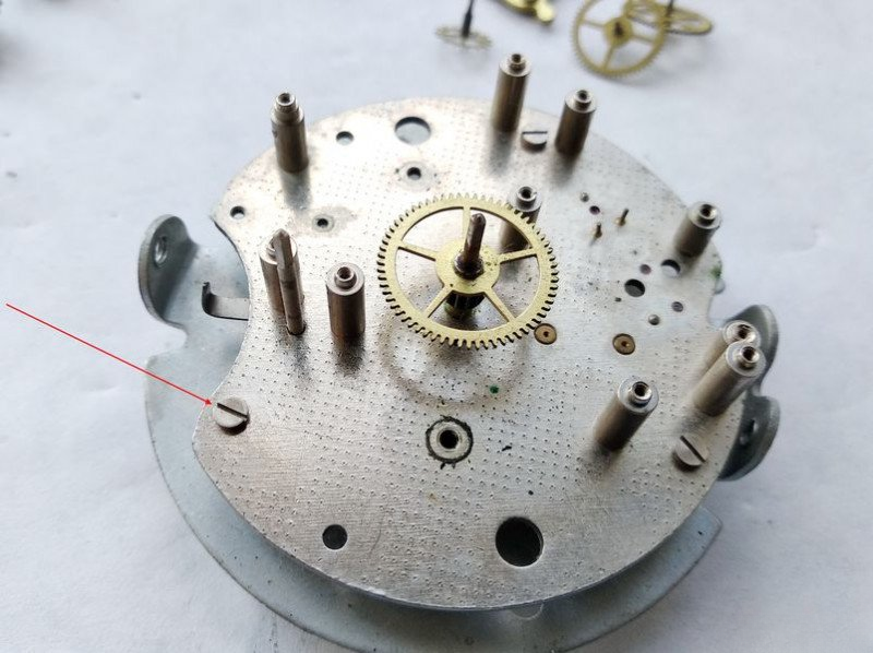 Removing alarm wheel plate mounting screws