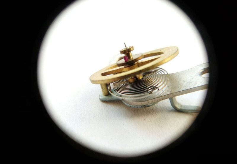Balance assembly showing impulse jewel and dirty regulator