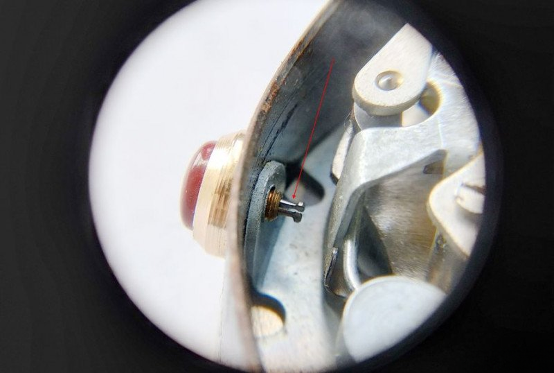 Removing alarm shutoff button with tweezers
