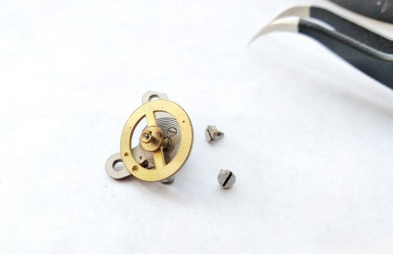 Removing balance wheel from alarm clock