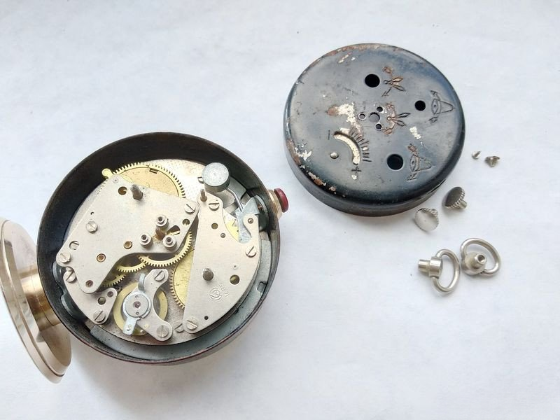 Slava caliber 5671 mechanism exposed showing brass barrels