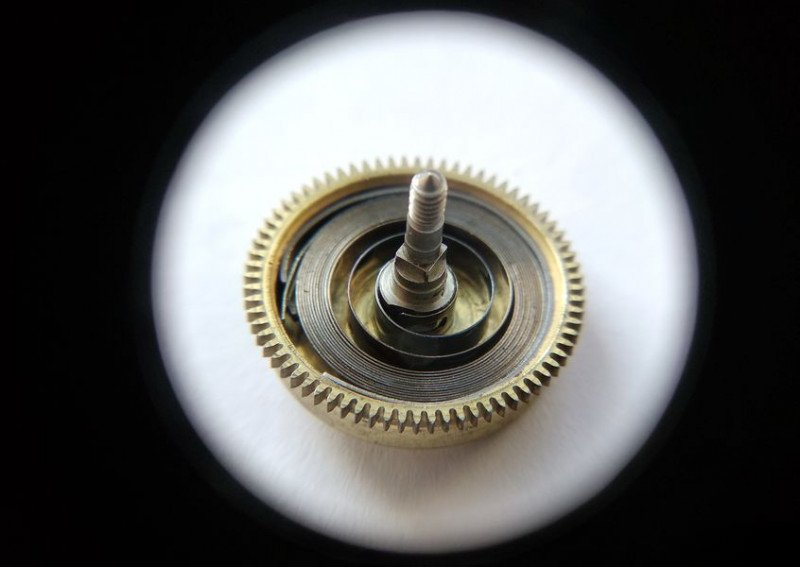 Installing and lubricating alarm spring