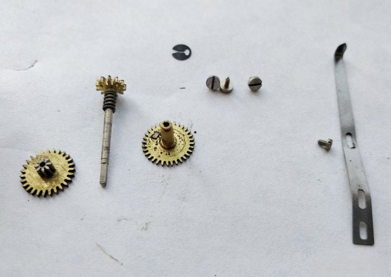 All motion work components laid out in sequence