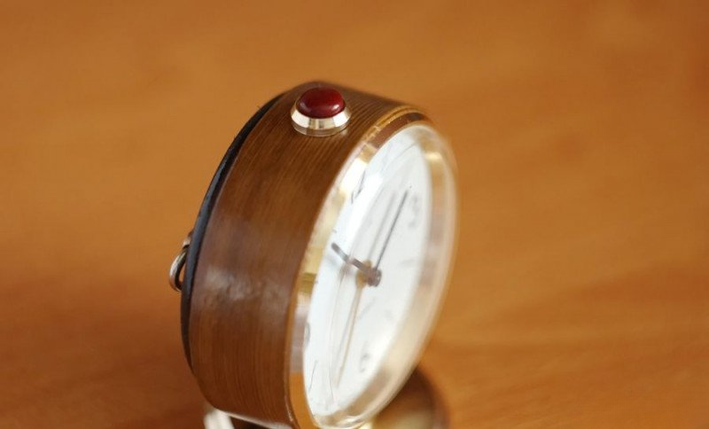 Restored clock side view showing refinished case