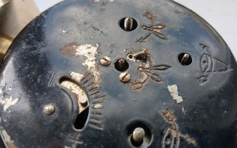 Removing back cover screws on alarm clock