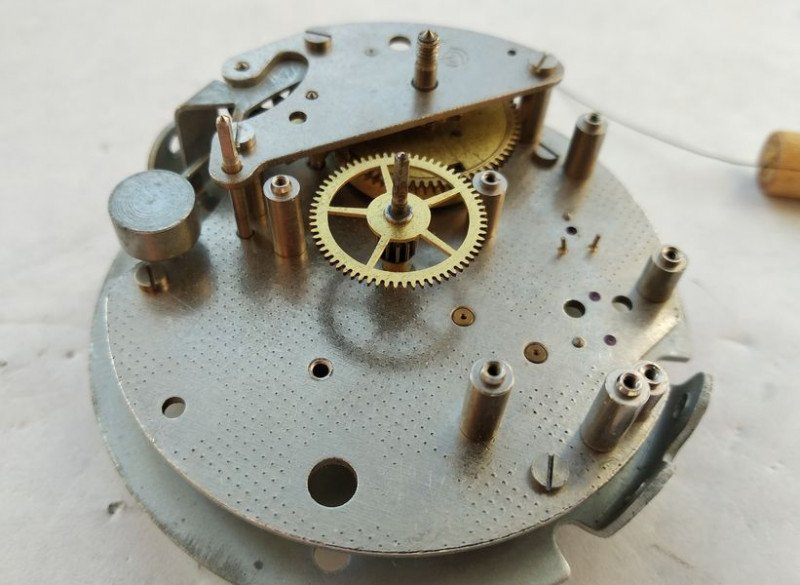Installing alarm mechanism bridge over assembly