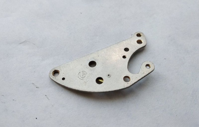 Alarm mechanism bridge top surface