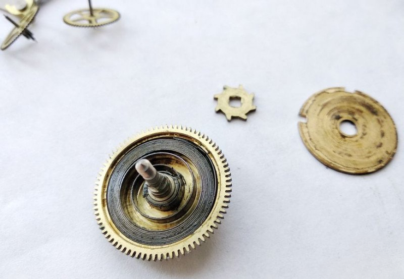 Opening mainspring barrel showing old lubricant