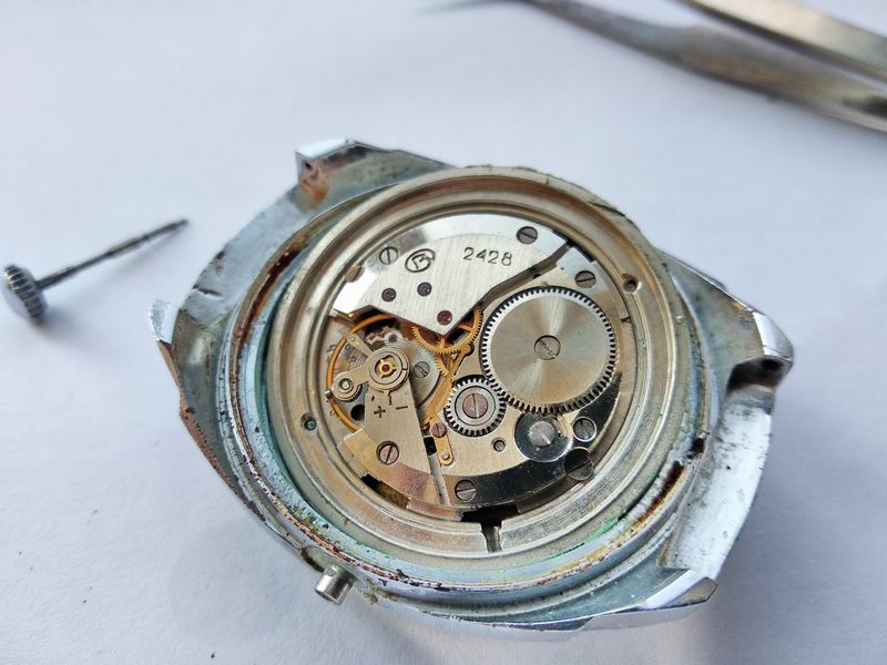 The 2428 movement leaving the case while seated in its larger 32 mm carrying ring