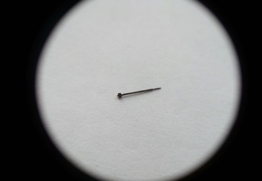The seconds pinion removed and shown on its own
