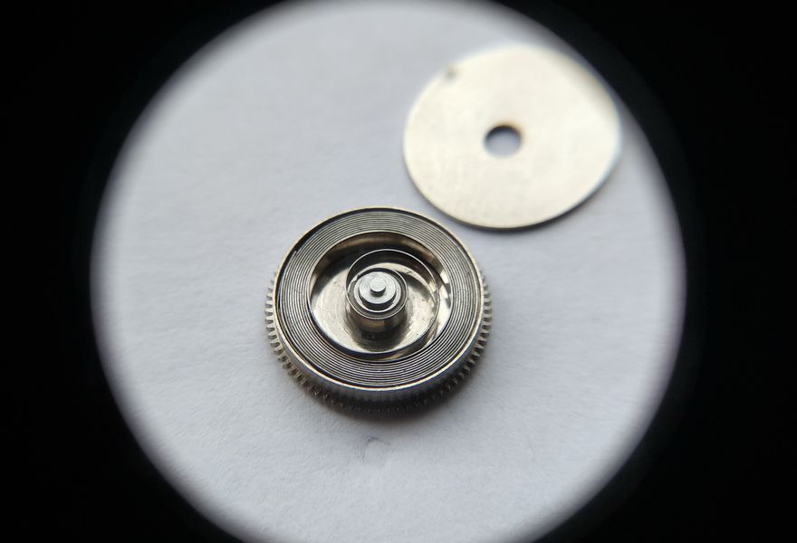 The clean mainspring in its barrel ready for lubrication