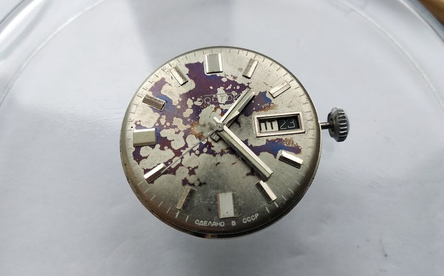 Fitting the hands, with the seconds hand pressed on while the movement sits on a support