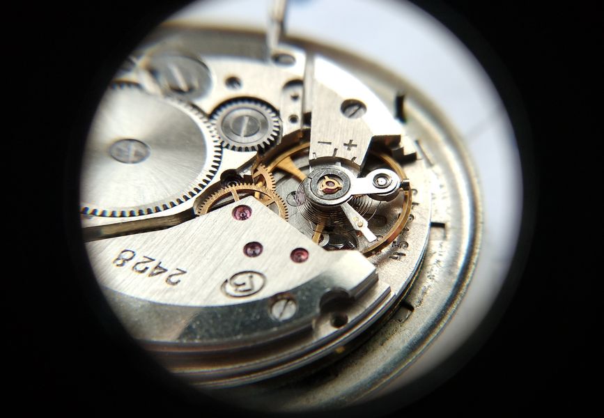 Removing the star spring from the balance cock bushing
