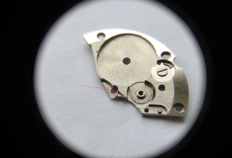 Applying oil to the center-wheel jewel in the barrel bridge