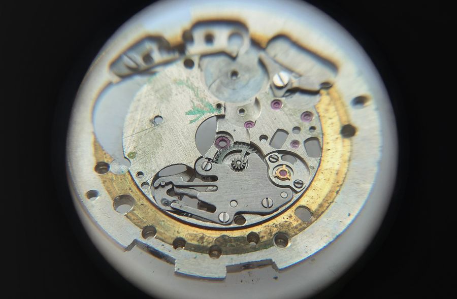 The keyless works under their spring cover plate, being disassembled