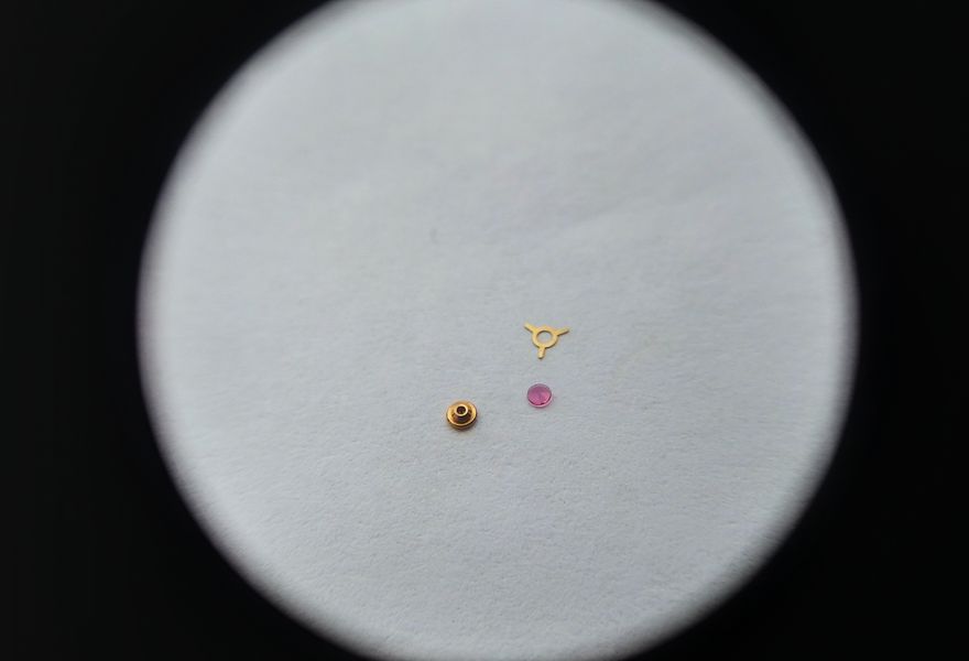 Oiling the cap jewel with Moebius 8000 before reassembling the bushing