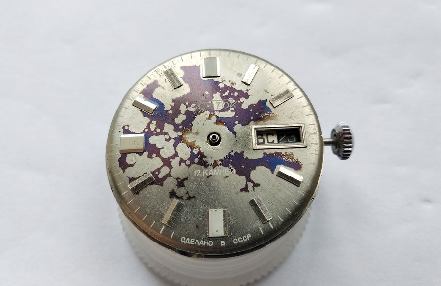 Refitting the stained dial to the movement