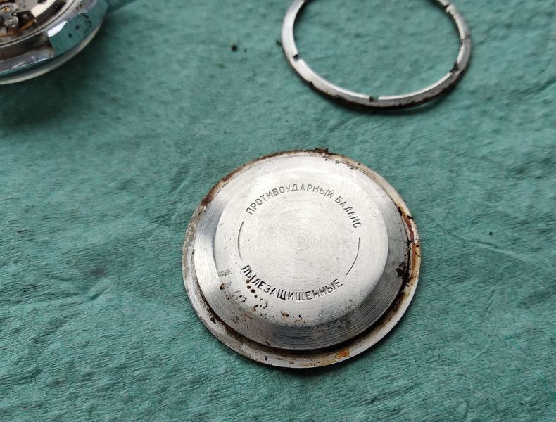 The exterior of the heavy screw-down case back with engraved markings