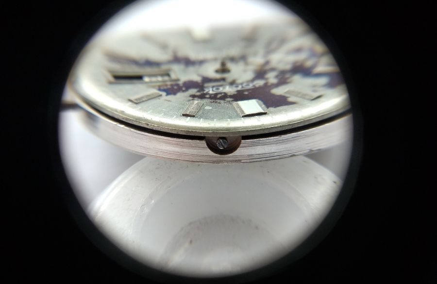 Securing the dial to the carrying ring