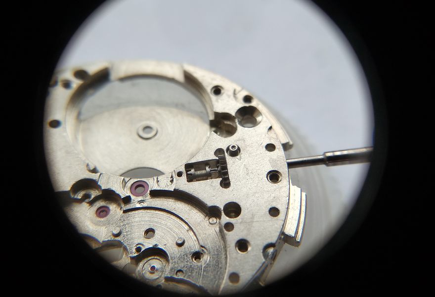 The stem-release button installed on the plate