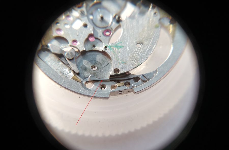 The accumulator spring left in place on the main plate for cleaning