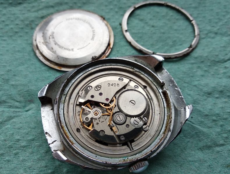 The Vostok 2428 movement exposed inside the open case