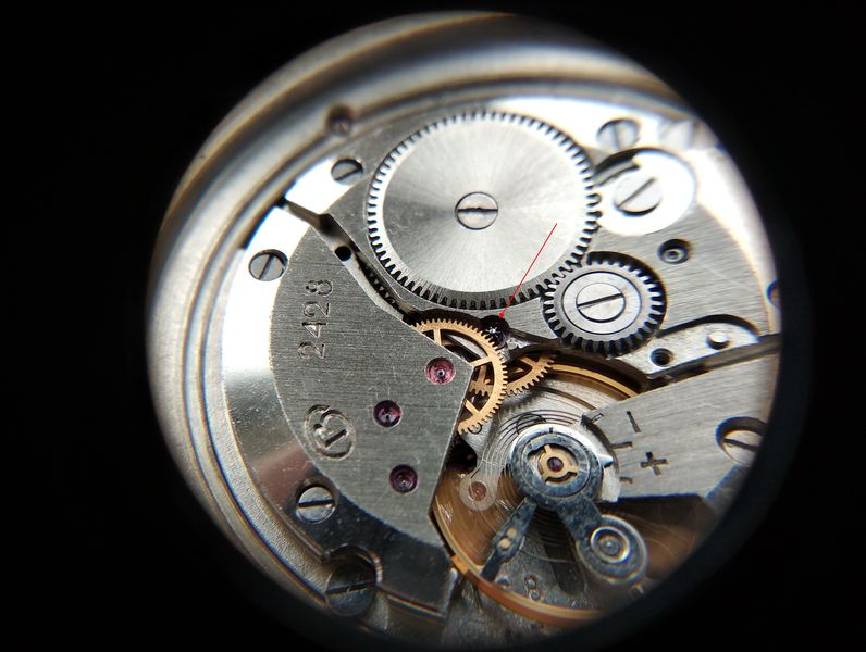 Oiling the seconds pin, installing the pinion and securing the hook lever