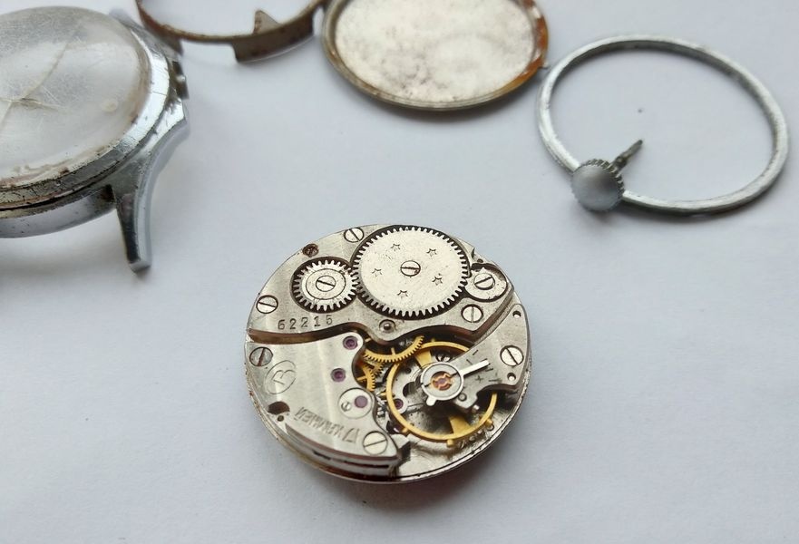 Vostok 2605 movement viewed from balance side showing gear train bridge Vostok logo serial number ratchet wheel