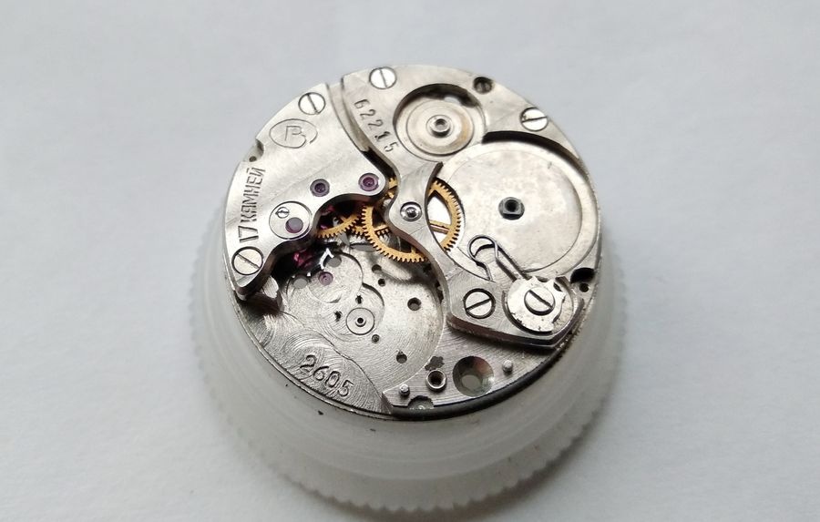 Vostok 2605 movement on holder bridge side fully assembled with all bridges barrel and ratchet wheel in place