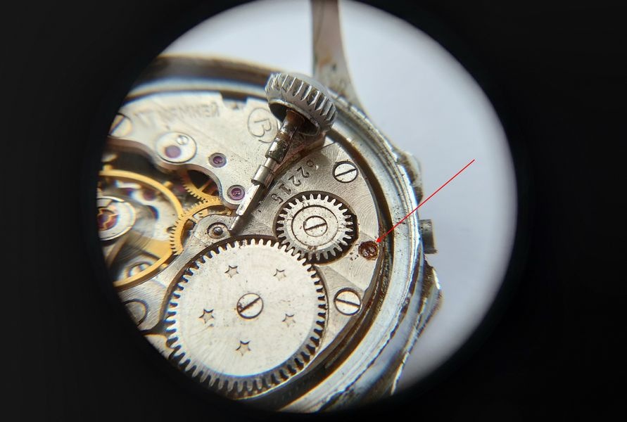Vostok 2605 movement being extracted from case after winding lever screw released and stem withdrawn