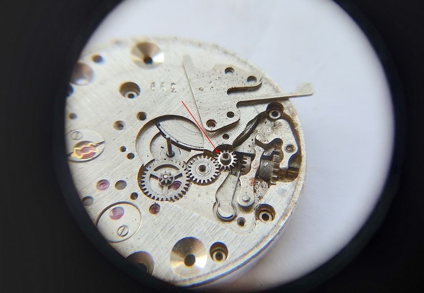 Vostok 2605 keyless works after cover removal through loupe showing transfer wheel installed upside down