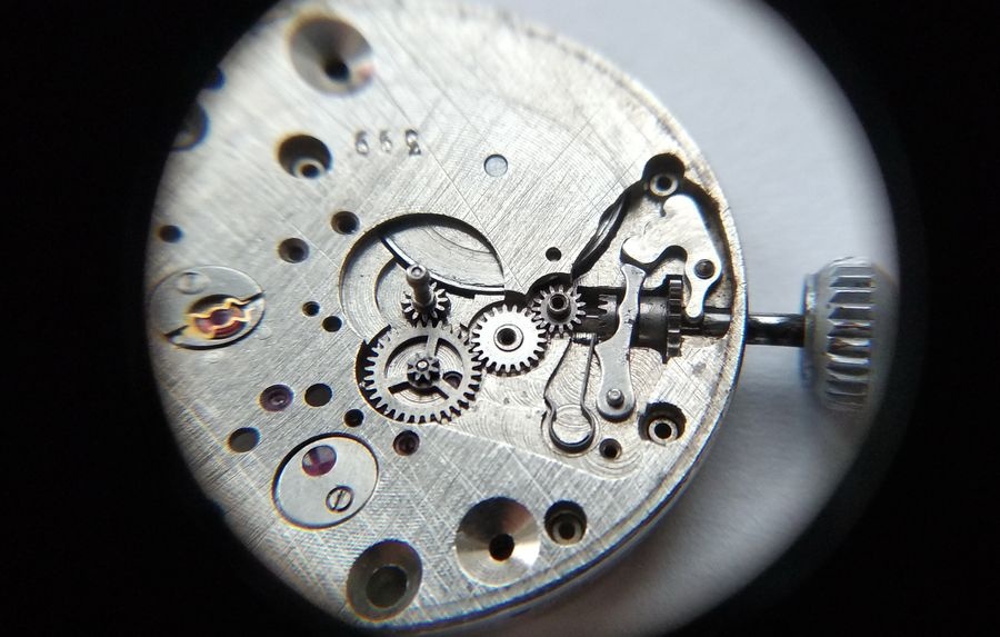 Vostok 2605 dial side through loupe with intermediate lever setting lever transfer wheel system and hour wheel assembled in keyless works