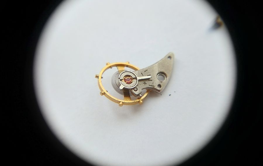 Vostok 2605 balance assembly from second angle showing incabloc lyre spring and bouchon detail in balance cock arm