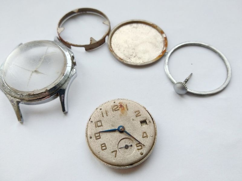 Vostok 2605 movement out of case viewed from dial side showing dial with hands and motion works all in place